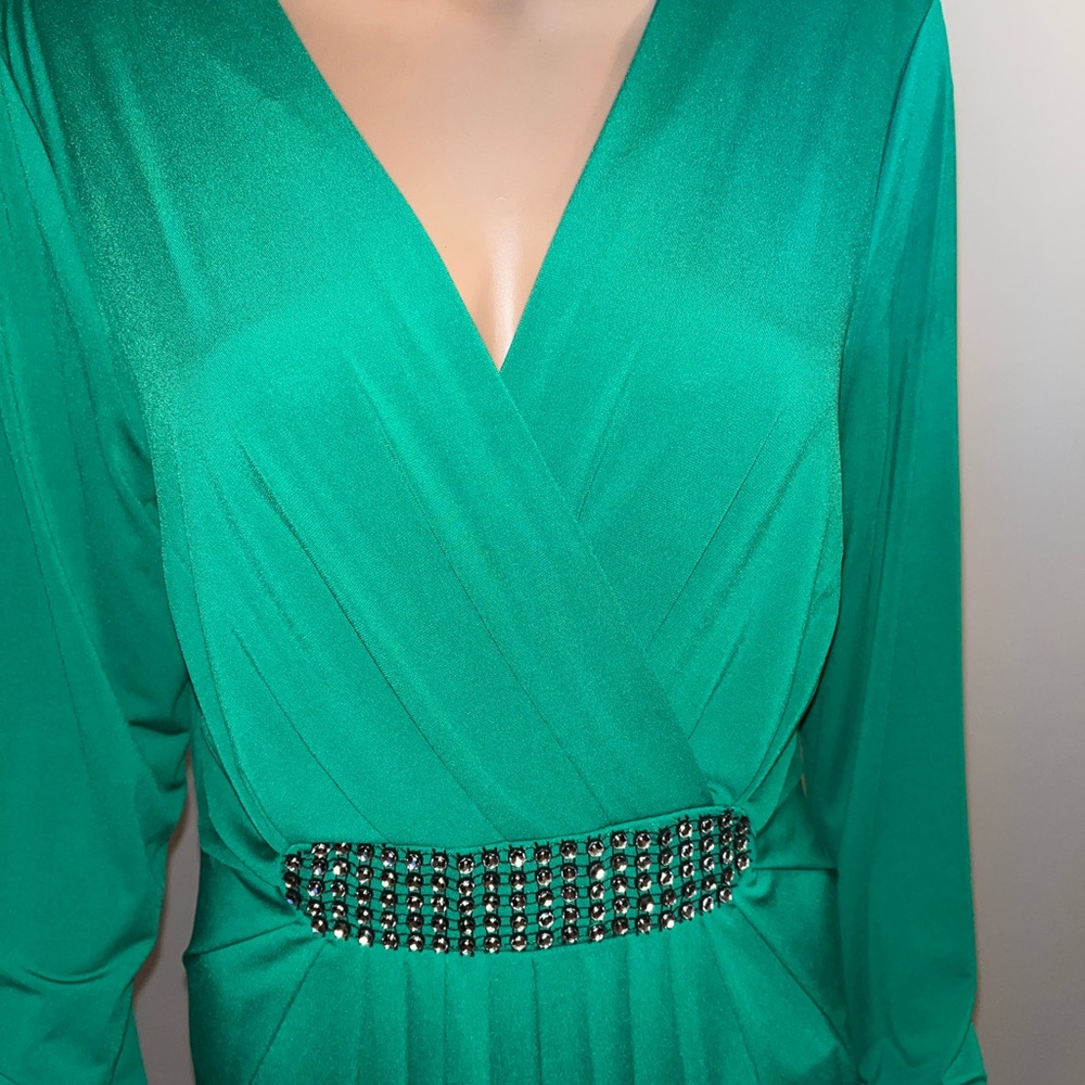 Formal dress .has a small stain on the left upper sleeve as shown.